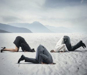 3-people-heads-in-sand